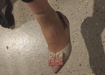 The lady in white heels dangling shoeplay when waiting for a call 15