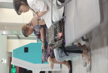 Lady remove heels relax her tired feet when line up in the waiting hall 17 