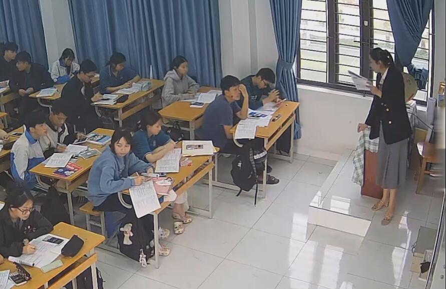 The teacher dangling shoeplay and dipping many times during class 11