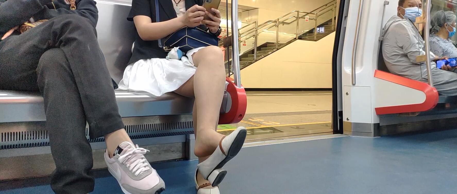 The hot lady dangling shoeplay on the subway
