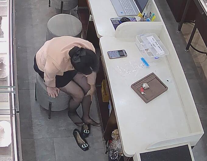 Today we can see her black nylon feet more clearly