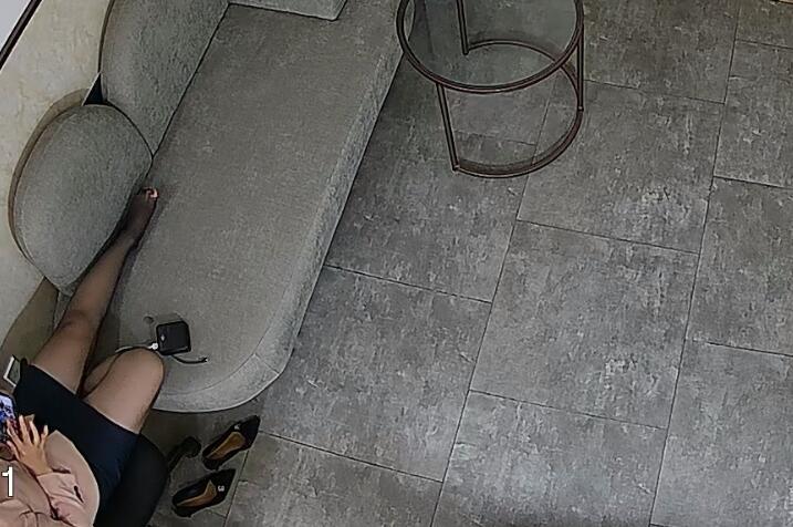 She relaxed her tired feet in the lounge